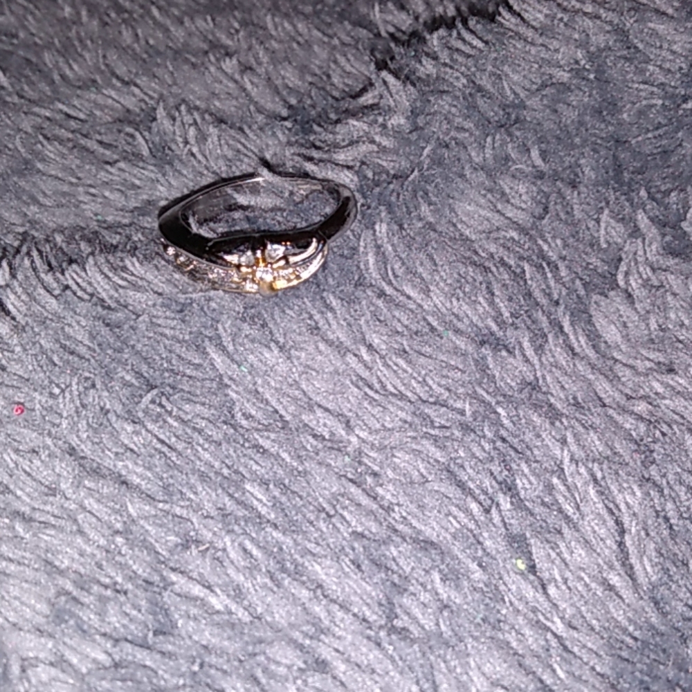 Cross ring wrapped with footprints sz 7